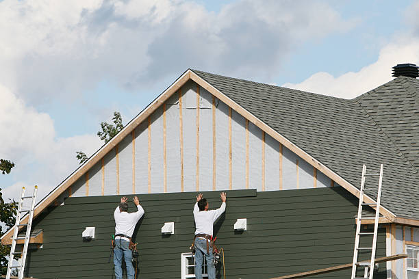 Professional Storm Damage Siding Repair technician working in Garden City, NY
